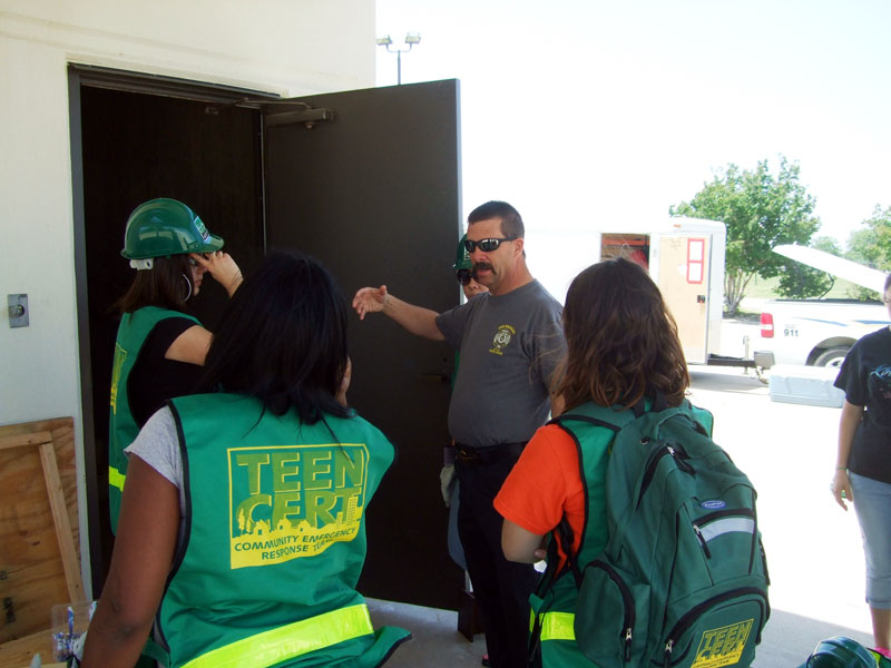 Photo of teens performing training duties